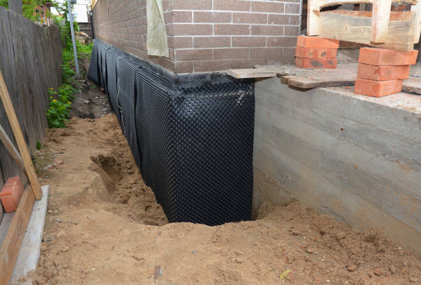 Happy homeowners after waterproofing job in Elkwood